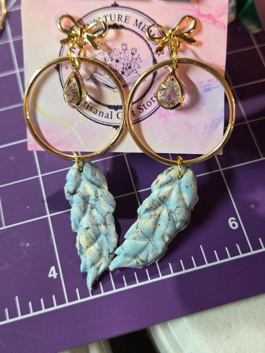 Marbled Midas Feather stud earrings.