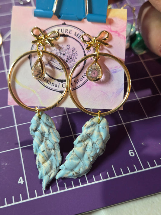 Marbled Midas Feather stud earrings.