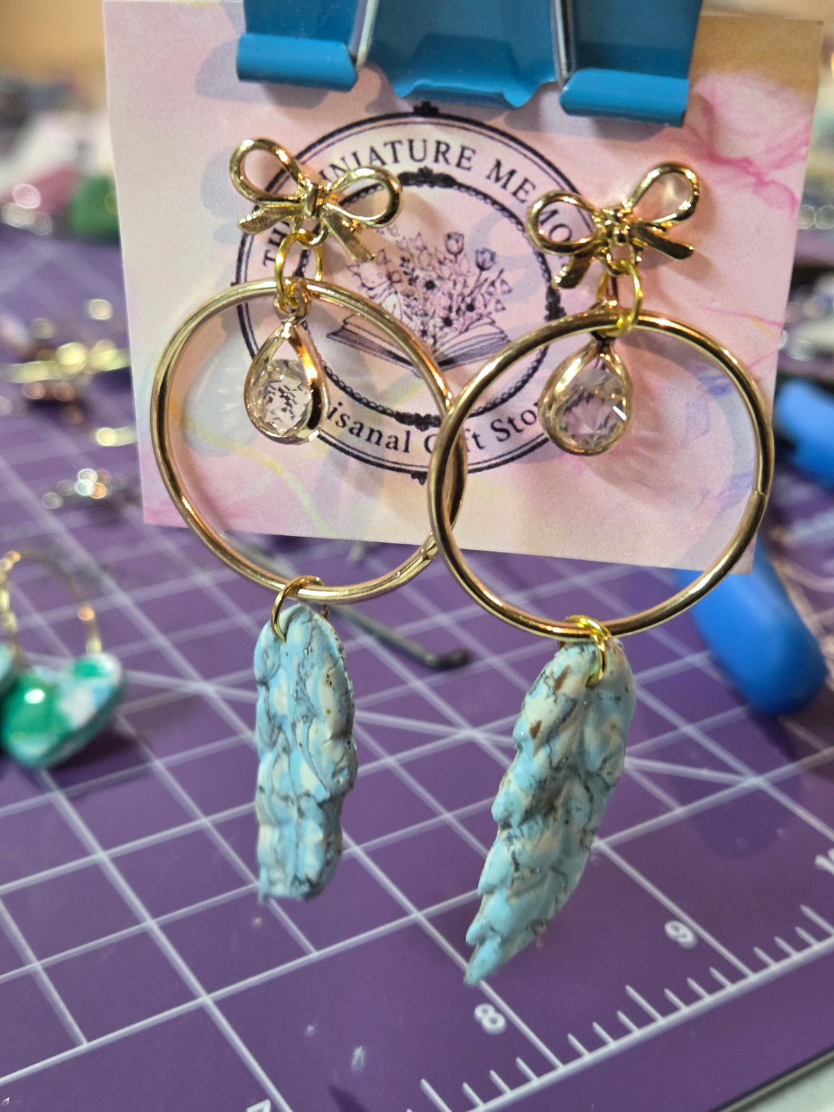 Marbled Midas Feather stud earrings.