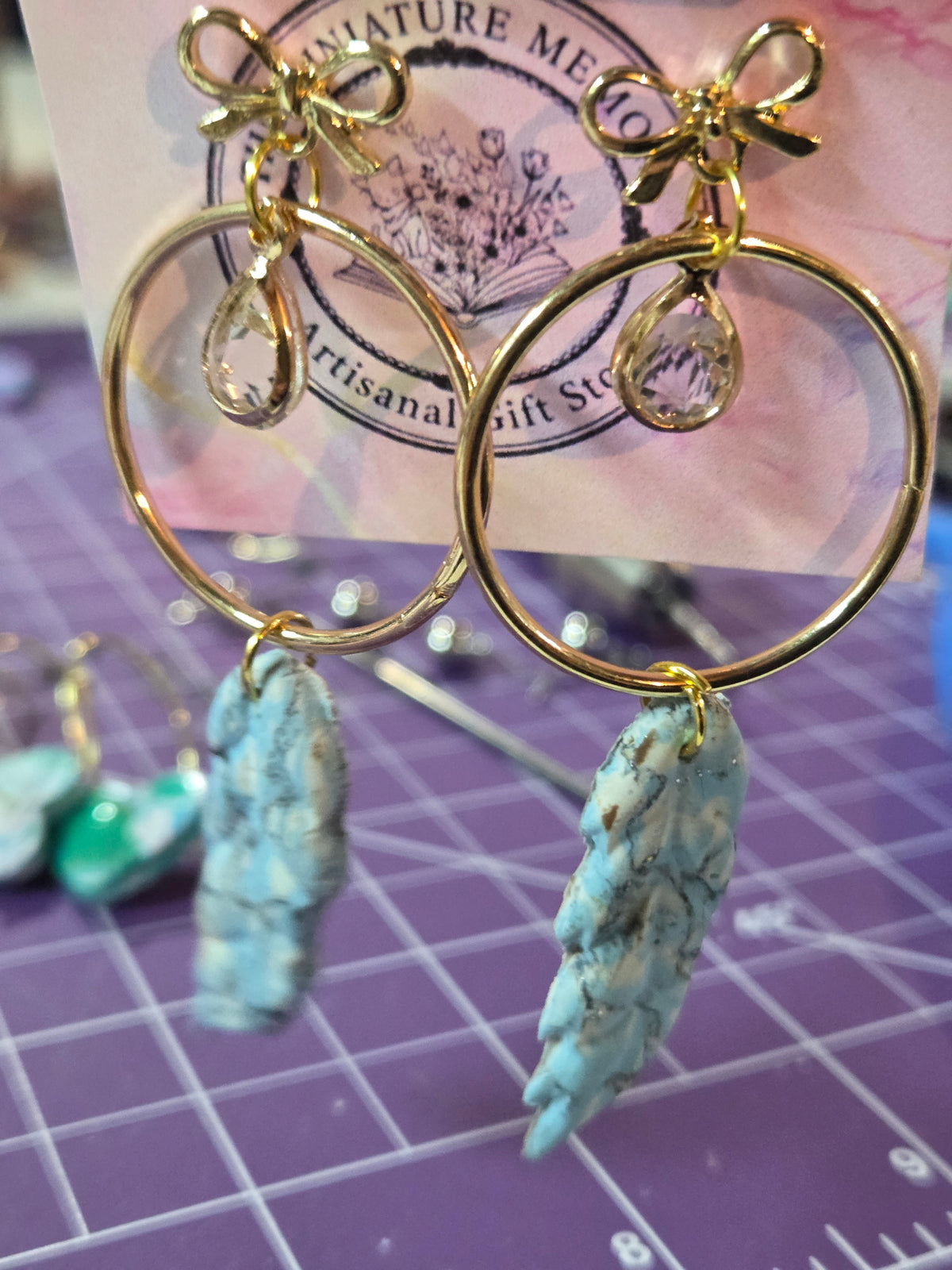 Marbled Midas Feather stud earrings.